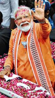 कैसे टोपी और गमछे से साधे पीएम मोदी एक तीर से दो निशाने